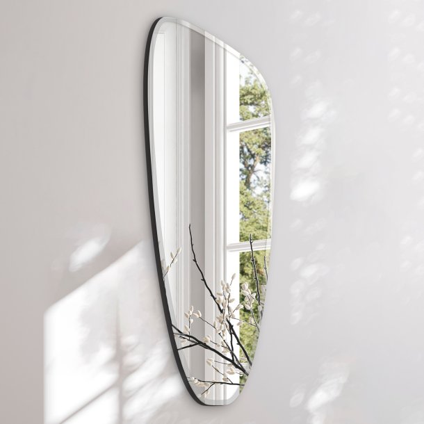 Asymmetrical mirror with beveled edge