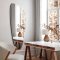 Asymmetrical mirror with beveled edge